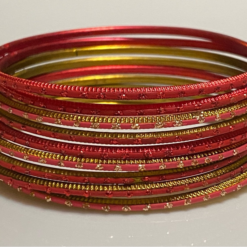 Gorgeous assorted red and gold bracelets. An accent with any holiday outfit.